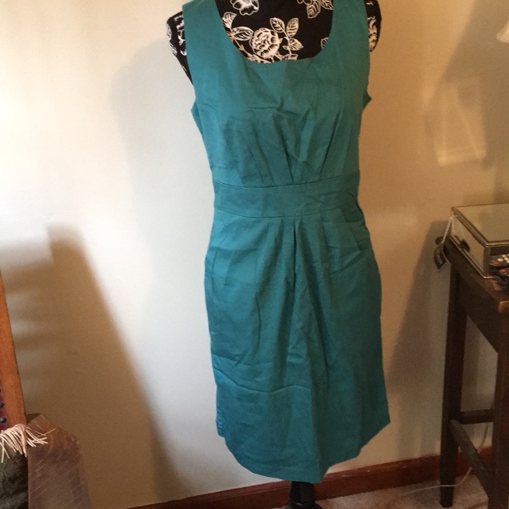 Beautiful very fitted Dress w/ Pleated Neckline.
